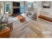 Bright living room with fireplace, plush seating, and large windows providing abundant natural light at 2007 Variations Ne Dr, Atlanta, GA 30329