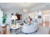 Bright living room featuring hardwood floors, curved sofas, and an open floor plan at 3101 Howell Mill Nw Rd # 327, Atlanta, GA 30327