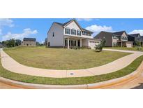 Charming two-story home with a spacious front yard and inviting curb appeal at 467 Daffodil Ln, Mcdonough, GA 30253