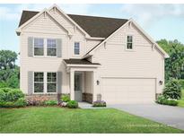 Two-story home with beige siding, stone accents, and a two-car garage at 63 Rocking Wood Vw, Dallas, GA 30157