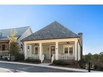 Charming craftsman-style home featuring a welcoming front porch and a well-maintained yard at 1130 Lupo Loop, Chattahoochee Hills, GA 30268
