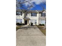 Charming townhouse with a well-maintained front yard and a classic design at 2438 Brianna Dr, Hampton, GA 30228
