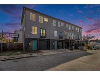 Three-story townhouses with attached garages and private balconies at 93 Terry Se St # A, Atlanta, GA 30312