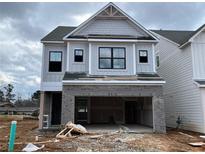 New two-story home with gray siding, brick accents, and a spacious two-car garage at 1059 Crest Mill Dr, Marietta, GA 30008