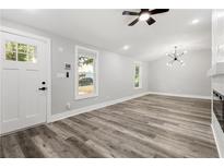 Bright living room with hardwood floors, fireplace, and high ceilings at 358 Roy Sw St, Atlanta, GA 30310