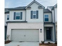 Two-story townhouse featuring neutral paint, and an attached garage at 2468 Bayberry St, Acworth, GA 30101