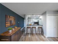 Open kitchen featuring modern countertops, breakfast bar, and stainless steel appliances at 375 Ralph Mcgill Blvd # 603, Atlanta, GA 30312