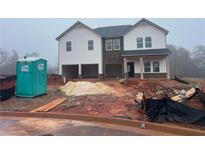 New two-story home shows off a modern exterior, awaiting landscaping and final touches at 311 Bianca Way, Mcdonough, GA 30253