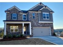 Two-story home with gray siding and stone accents at 422 Westmarch Cir, Loganville, GA 30052