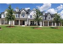 View of newly constructed townhomes with landscaped lawns and modern architectural details at 4107 Futral Way, Acworth, GA 30101