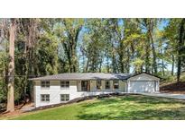 Newly renovated ranch home with a large backyard and modern facade at 2615 Holly Ln, Marietta, GA 30062