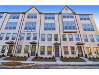 Three-story townhouses with brick facade and modern design at 3879 Allegretto Cir # 116, Atlanta, GA 30339