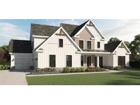 Inviting two-story home featuring white siding, complemented by stone accents and a well-manicured lawn at 5893 Fords Rd, Acworth, GA 30101