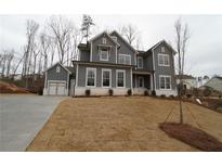 Charming gray two-story home with manicured lawn and attached garage at 1975 Sage Lake Bend Sw, Marietta, GA 30064