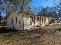 Ranch style home with updated siding and landscaping at 5312 Westford Cir, Atlanta, GA 30349