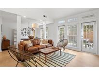 Bright living room features stylish seating, hardwood floors, and natural light from windows at 1827 Rockridge Pl, Atlanta, GA 30324