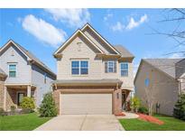 Charming two-story home with a two-car garage, lawn and landscaped front yard at 3372 Baylor Cir, Mcdonough, GA 30253