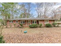 Charming one-story brick home with a manicured lawn and mature trees, offering great curb appeal at 4485 Canary Ct, Lithia Springs, GA 30122