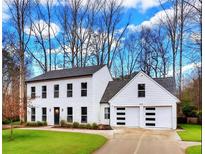 Charming two-story home with a two car garage and neatly manicured lawn at 3290 Ethan Dr, Marietta, GA 30062