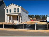 Newly built two story home featuring brick and siding with a covered front porch at 500 Aberdeen Meadow Ln, Acworth, GA 30102