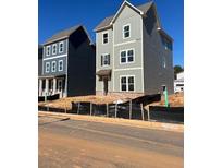 Charming new two-story home with light grey siding and a welcoming front entrance at 504 Aberdeen Meadow Ln, Acworth, GA 30102