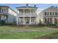 Two-story house with front porch and landscaped yard at 241 Thompson St, Alpharetta, GA 30009
