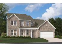 Beautiful two-story brick home with a manicured lawn, attached garage, and classic architectural details at 714 Ocmulgee Xing, Locust Grove, GA 30248