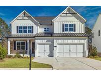 Beautiful two-story home featuring a two-car garage, well-maintained lawn, and classic design at 3330 Hillshire Dr, Cumming, GA 30028