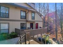 Attractive exterior of a townhouse with a deck and wooded views at 1608 Woodcliff Ne Dr, Atlanta, GA 30350