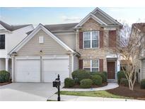 Charming two-story home with a two-car garage, well-maintained landscaping, and inviting curb appeal at 276 Balaban Cir, Woodstock, GA 30188