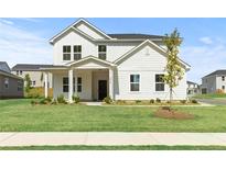 Charming two-story home with white siding, a welcoming front porch, and a well-manicured lawn at 3650 Olive Grove Ln, Covington, GA 30016