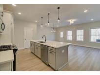 Modern kitchen with stainless steel appliances and an island at 4521 Twinberry Dr, Powder Springs, GA 30127