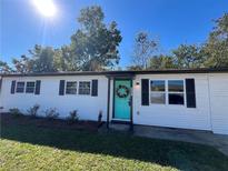Charming ranch home with a freshly painted exterior and landscaping at 1015 Maxham Rd, Austell, GA 30168