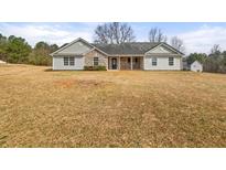 Charming ranch-style home with stone accents and a well-maintained yard at 85 Blue Jay Dr, Covington, GA 30016