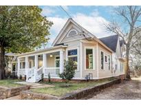 Charming renovated home with a spacious front porch and landscaped yard at 359 Woodward Se Ave, Atlanta, GA 30312