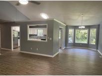 Bright dining area with hardwood floors and large windows at 6506 S Gordon Rd, Austell, GA 30168