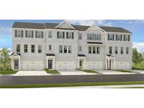 Three-story townhouses with gray brick exterior, two-car garages, and landscaping at 242 Lytham Se Dr, Mableton, GA 30216