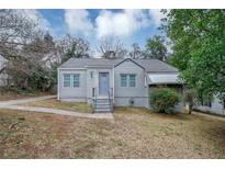 Charming gray house with a spacious yard and walkway at 1454 Westridge Sw Rd, Atlanta, GA 30311