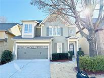 Charming two-story home featuring a gray exterior, attached garage, and well-maintained landscaping at 3596 Harvest Ridge Ln, Buford, GA 30519