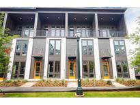 Modern townhome exterior with large windows, balconies, and colorful front doors at 462 Latta Ne St, Atlanta, GA 30308