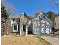 Charming two-story home featuring stone accents and a two-car garage at 2317 Rocksram Ct, Buford, GA 30519