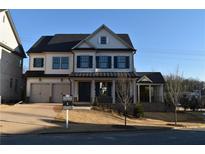 Two-story house with gray roof, white siding, and dark shutters at 3065 Barnes Mill Ct, Roswell, GA 30075