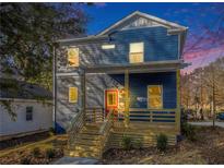 Stunning two-story home with a charming front porch at 935 Smith Sw St, Atlanta, GA 30310