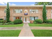 Charming apartment building with a brick facade, manicured lawn, and inviting entrance with the building number 200 at 2240 Cheshire Bridge Rd # 205, Atlanta, GA 30324