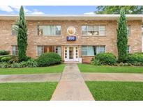 Charming building with stone facade, well-maintained landscaping, and clear address signage, creating an inviting curb appeal at 2240 Cheshire Bridge Rd # 205, Atlanta, GA 30324