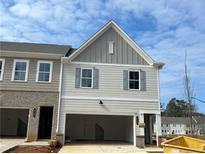 New two-story townhome showcases gray siding, gray shutters, and a spacious, attached two-car garage at 417 Carrera Ln, Acworth, GA 30102