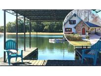 Lakefront home with private dock and relaxing water views at 6460 Pine Ridge Cir, Cumming, GA 30041