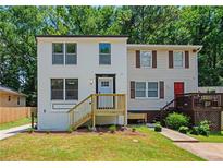 Newly renovated duplex with modern exterior and landscaping at 2371 Wingfoot Pl, Decatur, GA 30035