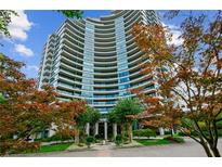 Luxury high-rise building with manicured landscaping at 700 Park Regency Ne Pl # 1105, Atlanta, GA 30326