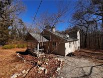 Ranch house with a wraparound porch and a large backyard at 3246 Wallace Lake Rd, Douglasville, GA 30135